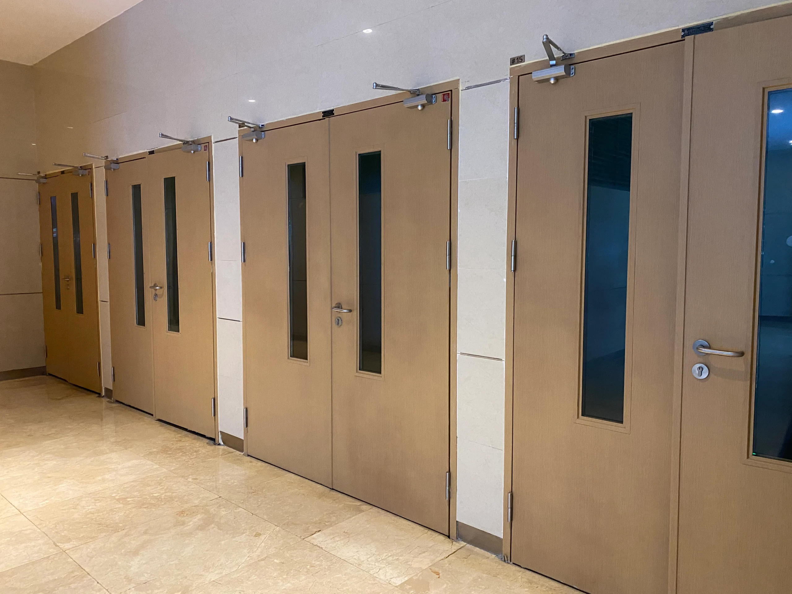 Installation of a fire rated doors in an office space, emphasizing its durability and safety features.