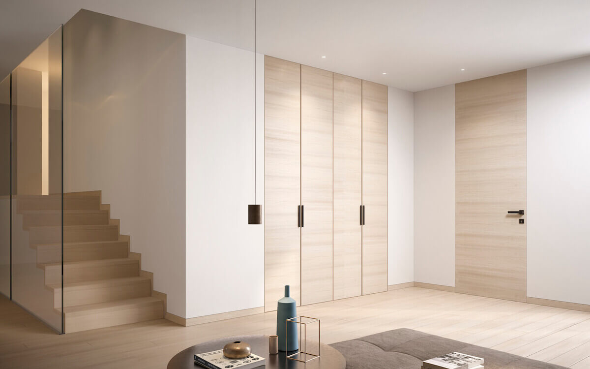 Hinged invisible door integrated into a sleek modern wall.