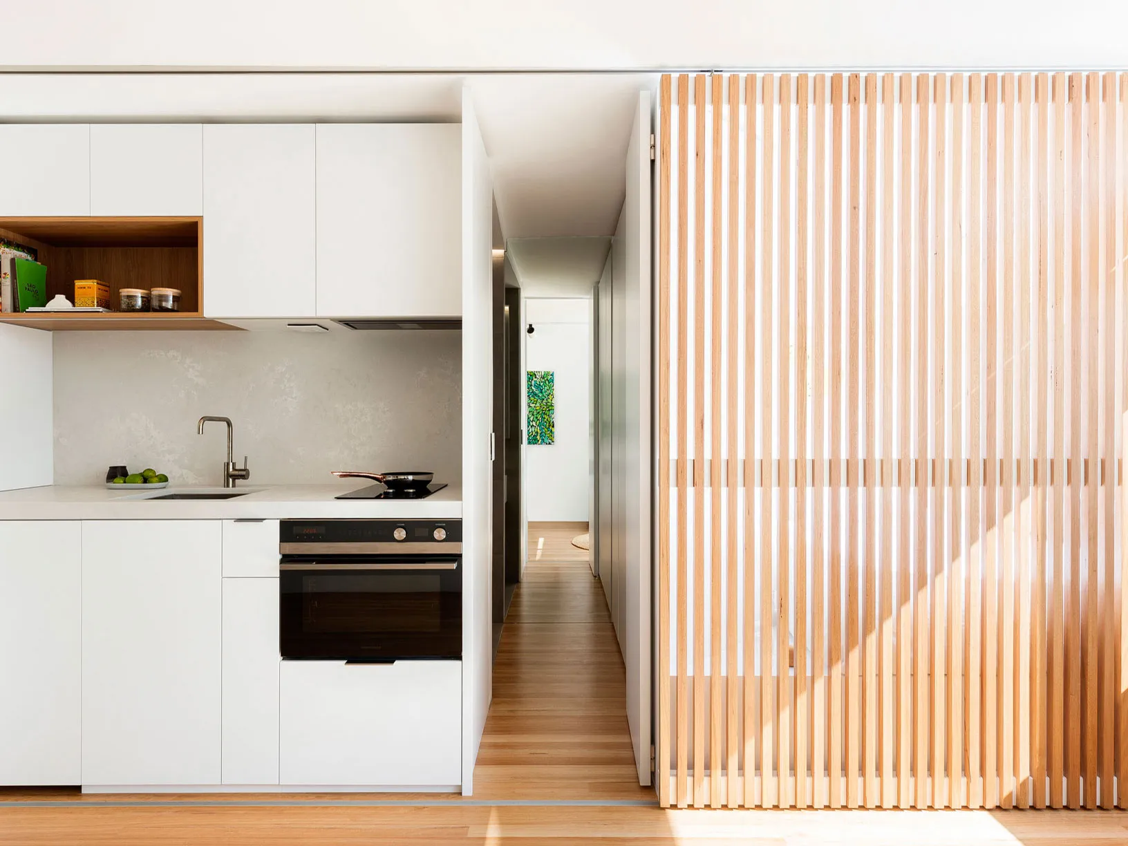 Modern slat door with sleek wooden panels, perfect for contemporary interiors.